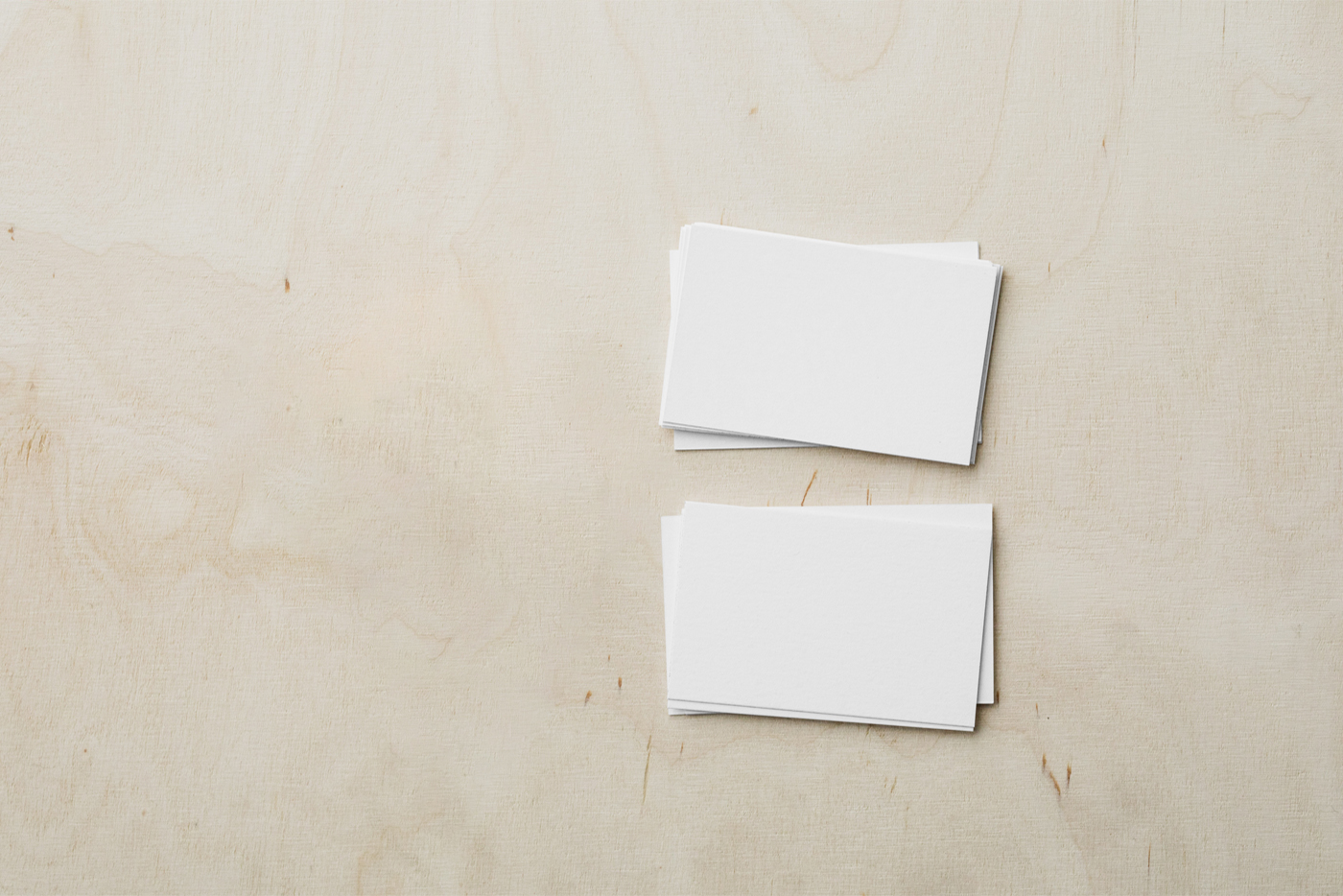 Plain business cards lying on plywood