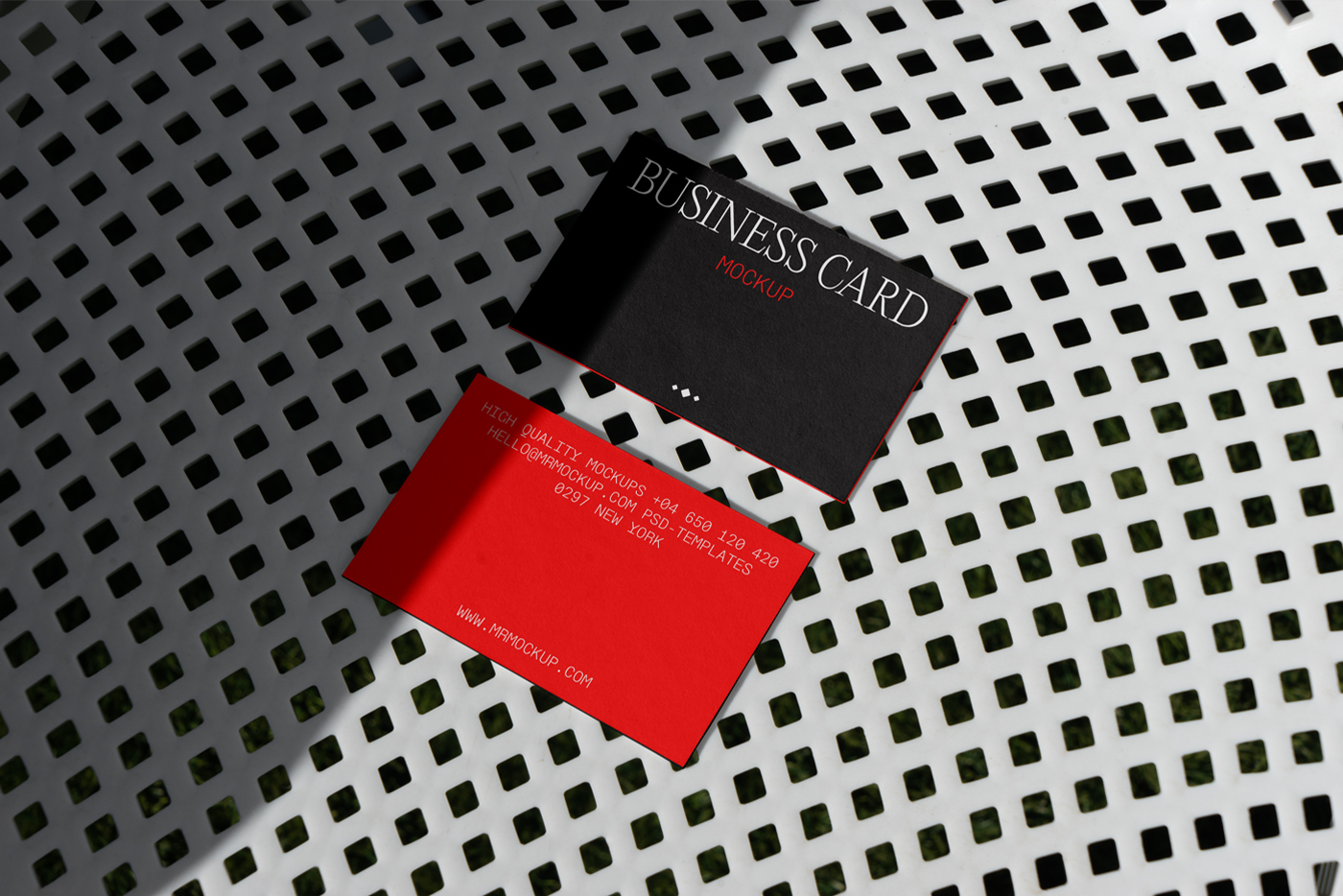 Business cards lying on a white trellised chair