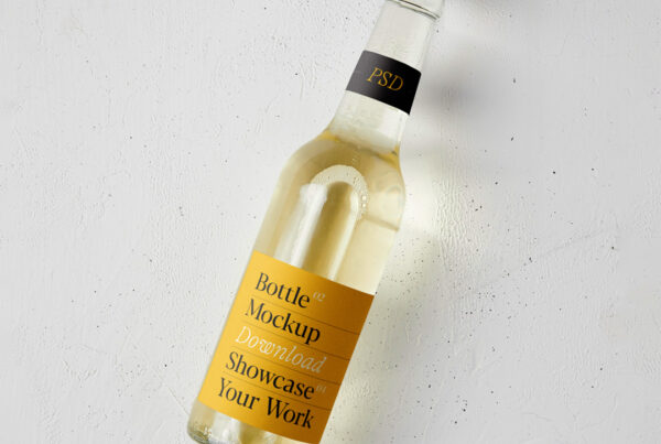 Small glass beer bottle mockup lying on a white floor.