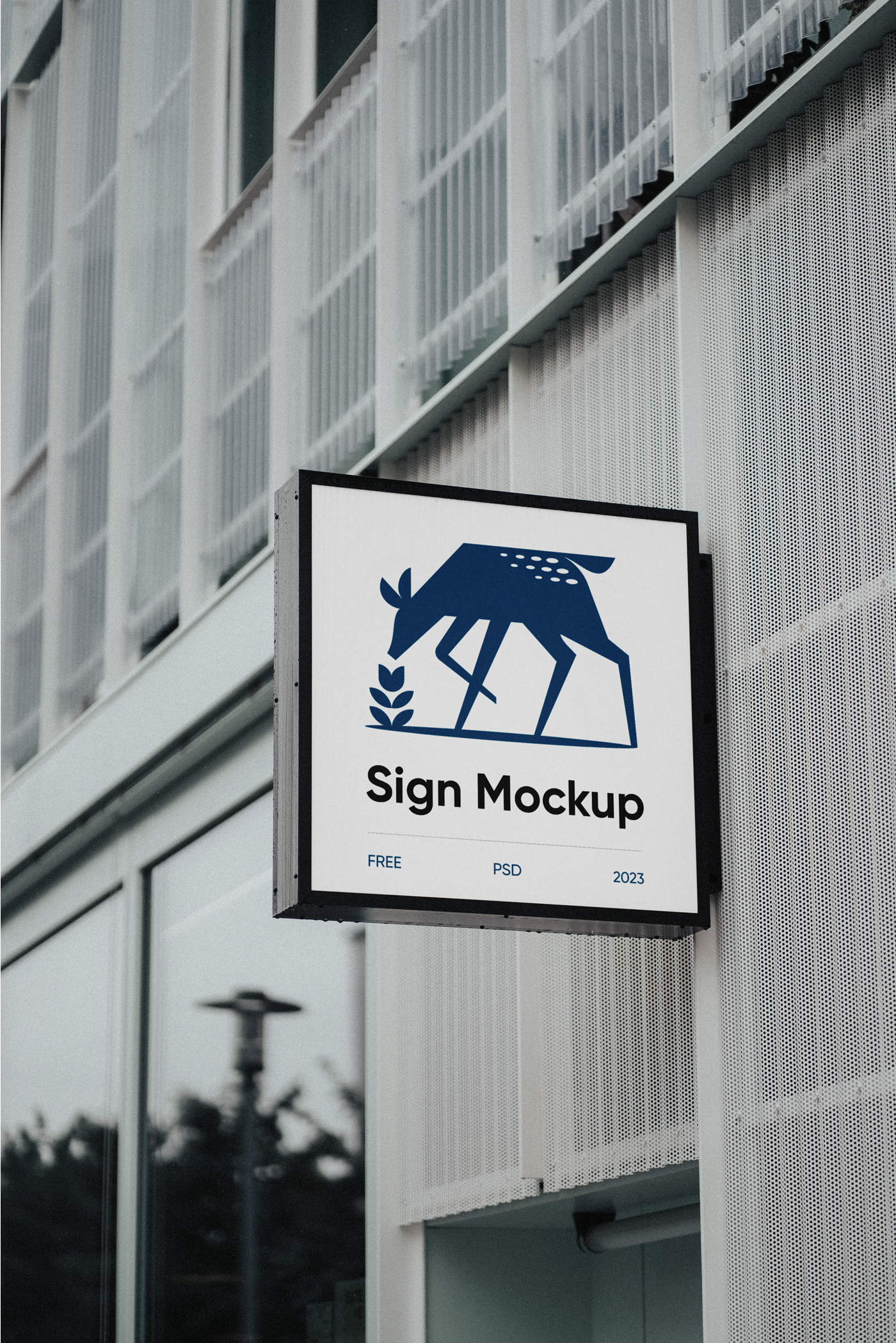 A Square Sign Mockup is hanging attached to the building.