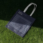 Canvas bag on the grass from outdoor branding porject.
