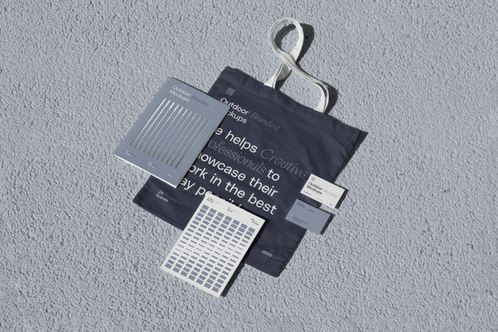 Canvas bag with notebook, business cards and card scene from outdoor branding mockups.