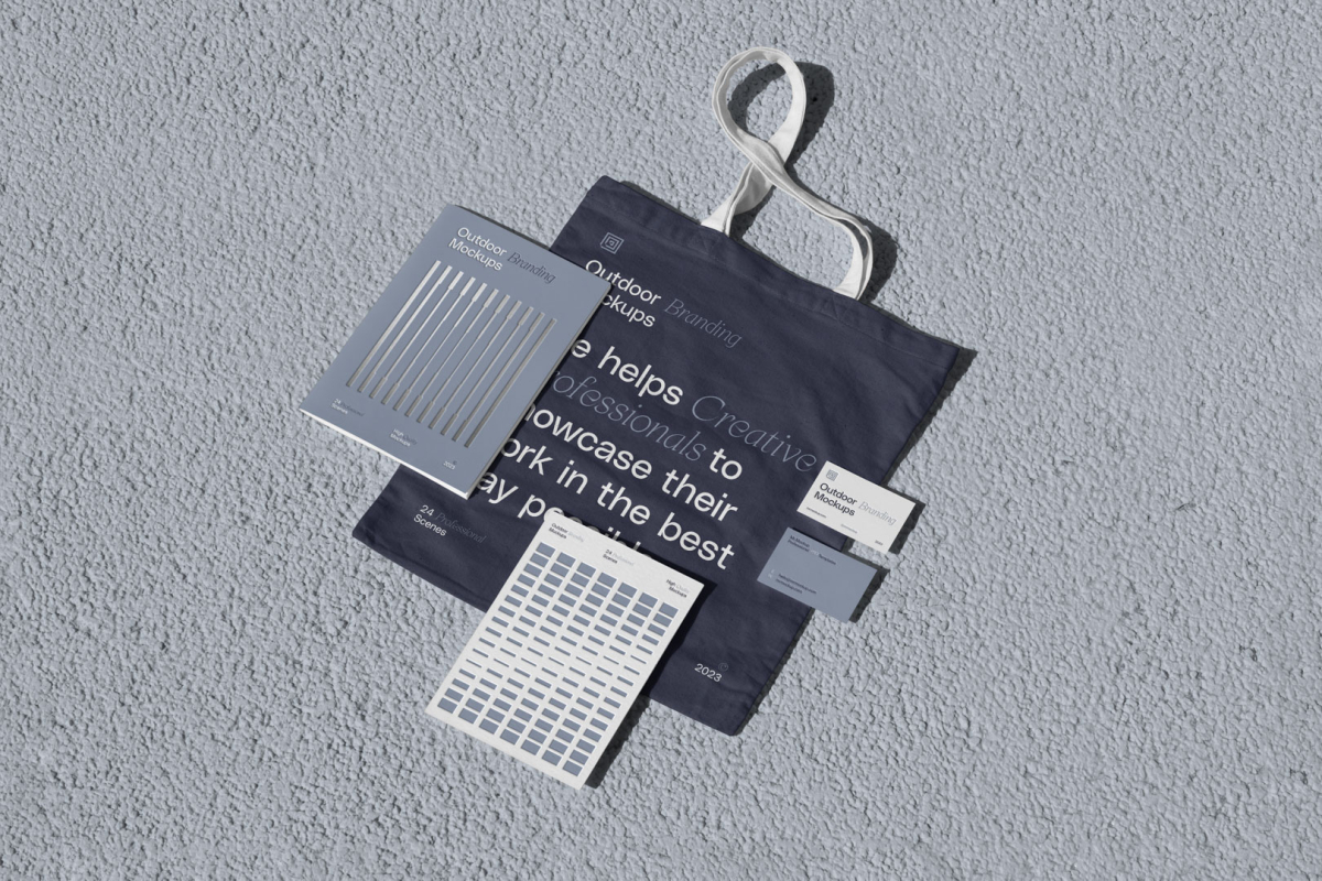 Canvas bag with notebook, business cards and card scene from outdoor branding mockups.