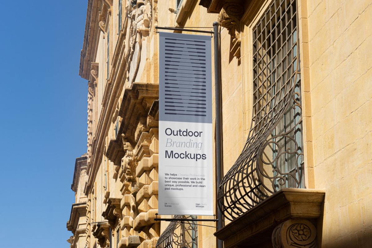 Flag on the old building from outdoor branding mockups.