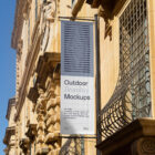 Flag on the old building from outdoor branding mockups.