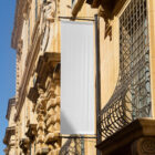 White flag on the old building from outdoor branidng mockups.