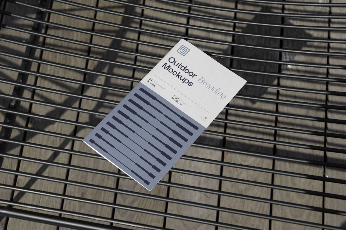 Brochure on the metal table from outdoor branding mockups.