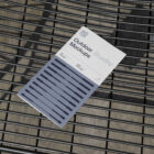 Brochure on the metal table from outdoor branding mockups.