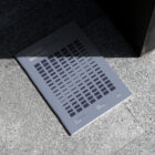 Notebook with blue project, on the granite floor from outdoor branding mockups.
