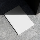 White notebook on granite floor from outdoor branding mockups.