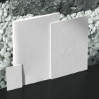 White notebook with card and buisness card from outdoor branding mockups.