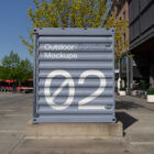 Blue container on the street made with outdoor branding mockups.