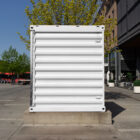 White container on the street from outdoor branding mockups.