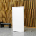 White plastic stand in front of wooden wall from outdoor braning mockups.