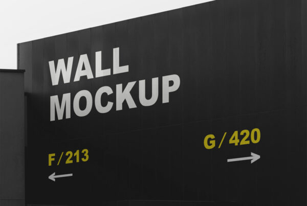 Free Black Wall Mockup against gray sky background.