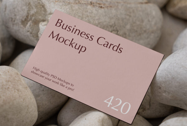 Free Business Card Mockup among stones background.