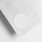 Big zoom on the white circle Sticker Branding Mockup glued to white card against a white background.