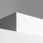 Viewed from below at an angle, a White Box Branding Mockup is standing on a white box against a white background.