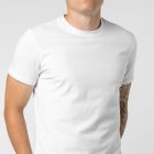 Men seen from front standing and wearing White T-Shirt Branding Mockup against a white wall.