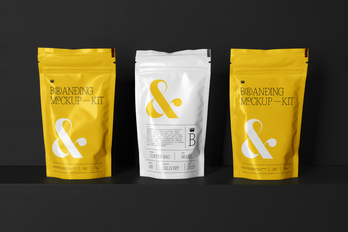Three Coffee Bags Branding Mockups Kit with yellow design seen from the front is standing located on the black wooden stairs.