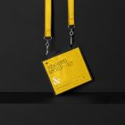 ID Lanyard Branding Mockups Kit with yellow design seen from front and located on the black wooden stairs.