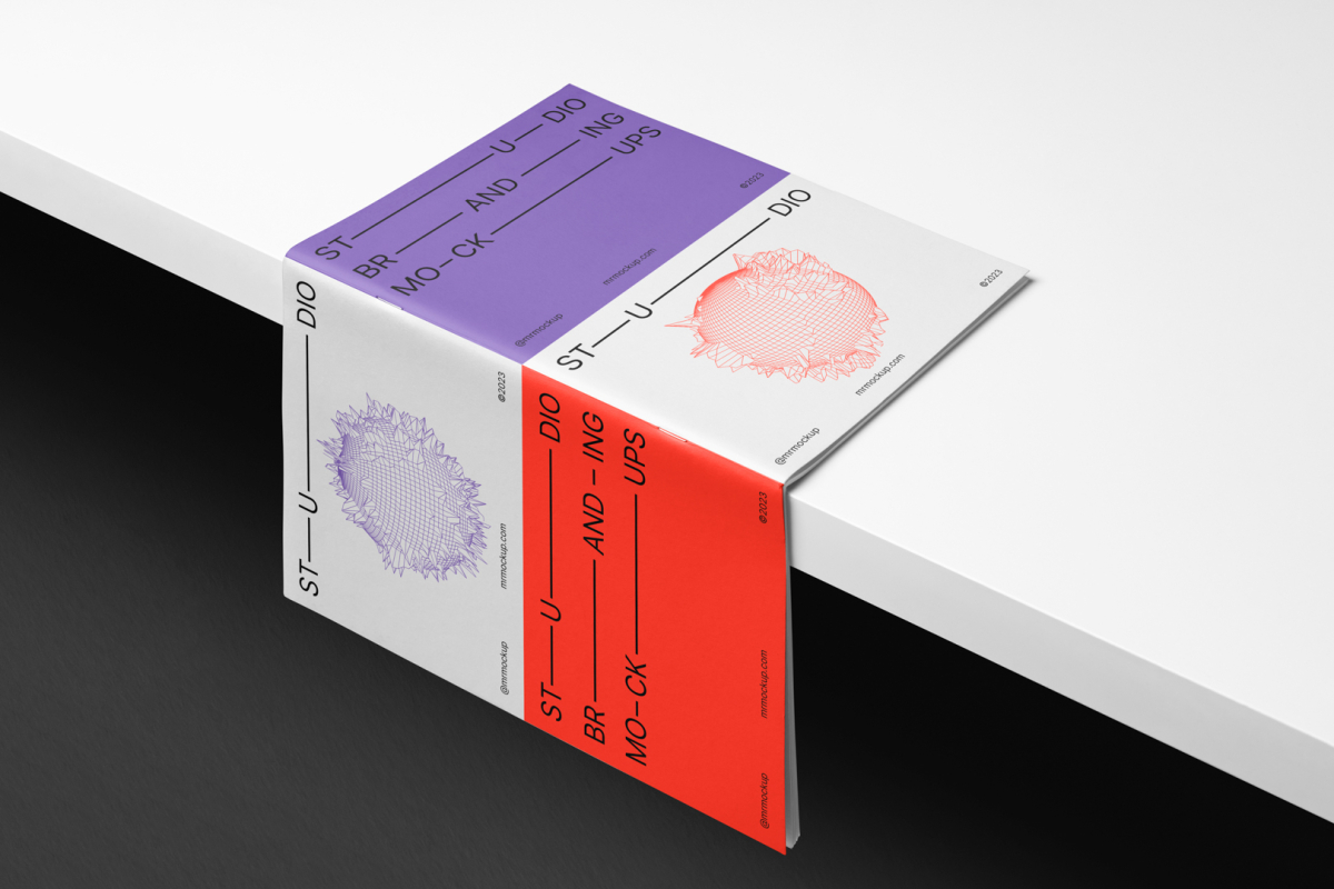 Magazine Branding Mockup seen from the above open and cover up laying on the white box above black background.