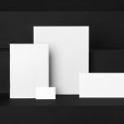 The White Stationery Set like Card, Business Cards, Envelope, Branding Mockups Kit seen from front and located on the black wooden stairs are arranged in nice composition.