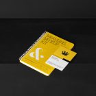 Notebook and Business Cards Branding Mockups Kit with yellow design seen from above and located on the black wooden stairs are arranged in composition.