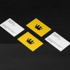 Business Cards Set Branding Mockups Kit with yellow design seen from above and located on the black wooden stairs.