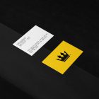 Business Cards Branding Mockups Kit with yellow design seen from above and located on the black wooden stairs.