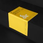 Notebook Branding Mockups Kit with yellow design seen from above and located on the black wooden stairs.