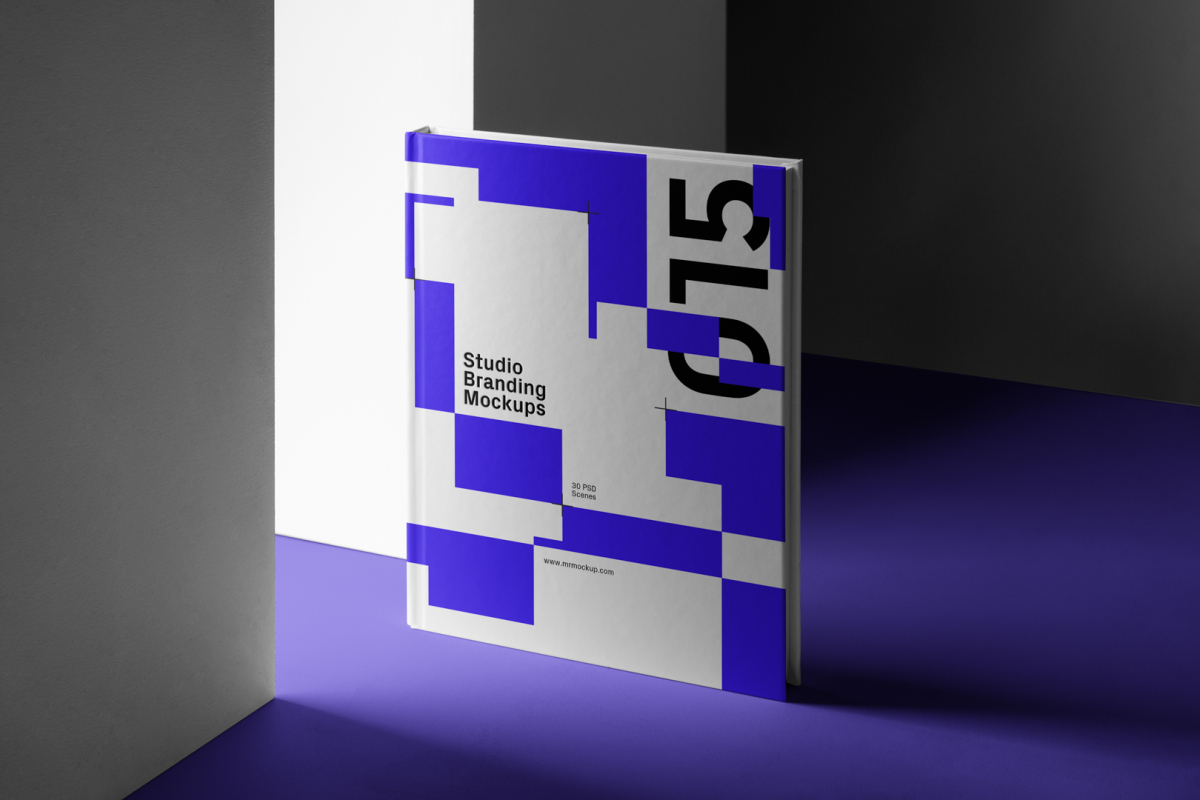 Seen from the front, Hardcover Book Branding Mockup standing on a purple floor between white walls.