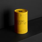 Tube Branding Mockups Kit with yellow design seen from front and located on the black wooden stairs.