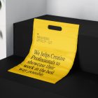 Plastic Shopping Bag Branding Mockups Kit with yellow design seen from above and located on the black wooden stairs.