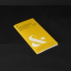 Leaflet Branding Mockups Kit with yellow design seen from above and located on the black wooden stairs.