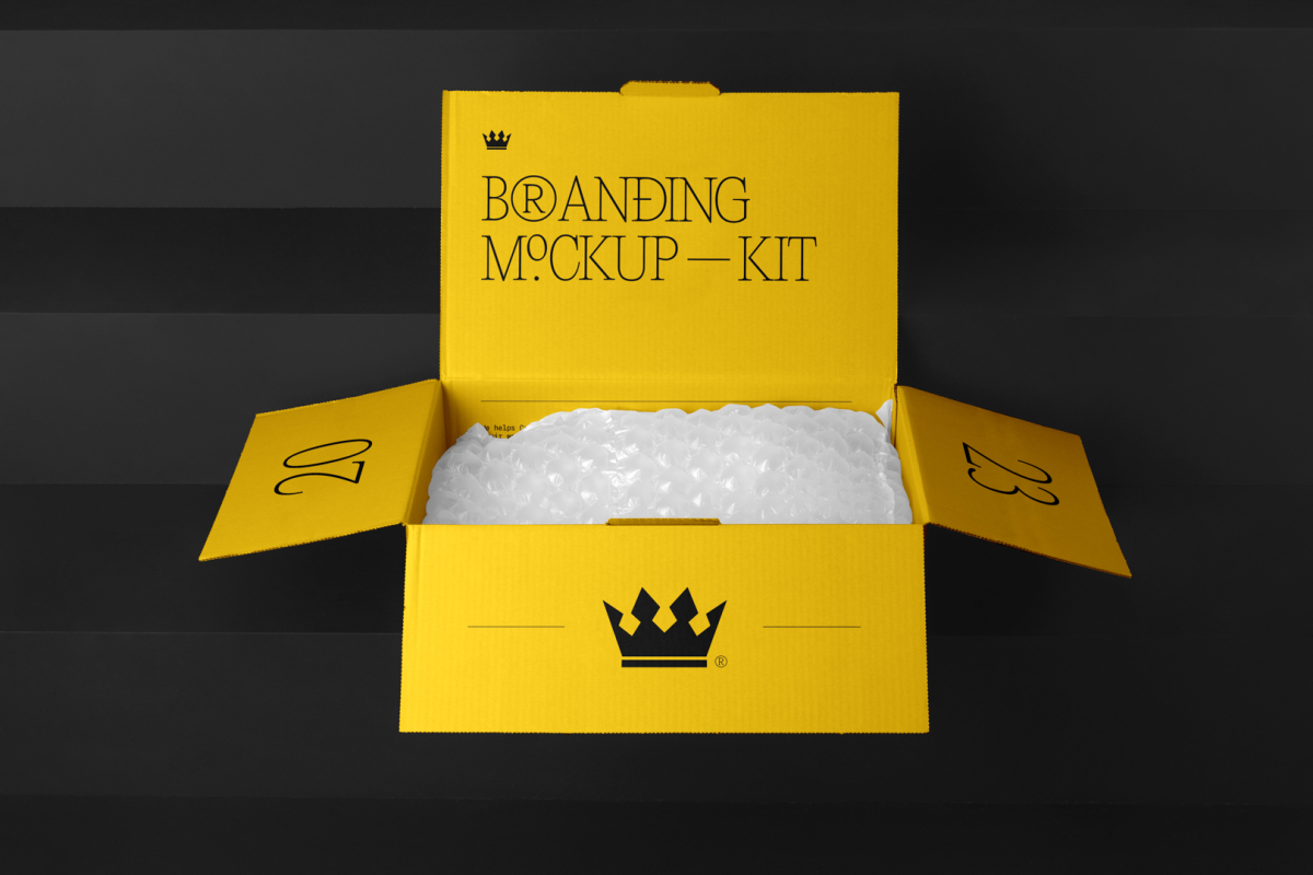 Packaging Box Branding Mockups Kit with bubble foil and yellow design seen from front and located on the black wooden stairs.