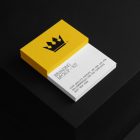 Business Cards Branding Mockups Kit with white and yellow design seen from above and located on the black wooden stairs.