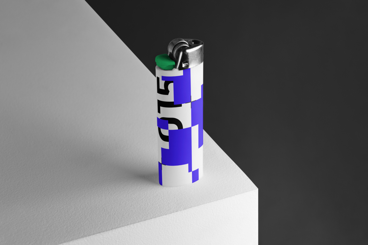 Lighter Branding Mockup with a blue and green design standing on the corner of the cubic against a black background.