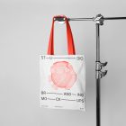 Seen from the front Canvas Bag Branding Mockup hanging on a tripod at light gray background.