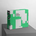 Box Branding Mockup with green design scene seen from front standing on gray cubic.