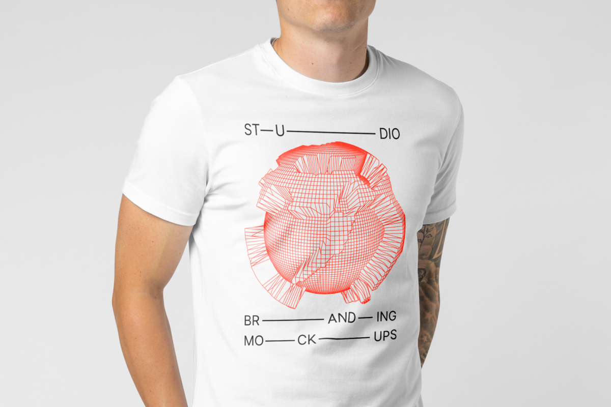 Men seen from front standing and wearing T-Shirt Branding Mockup against a white wall.