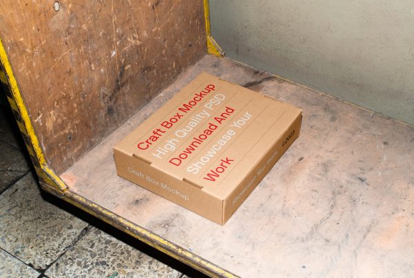 View from above, Free Box Lying on a Trolley Mockup, with red and white typography inside the magazine.