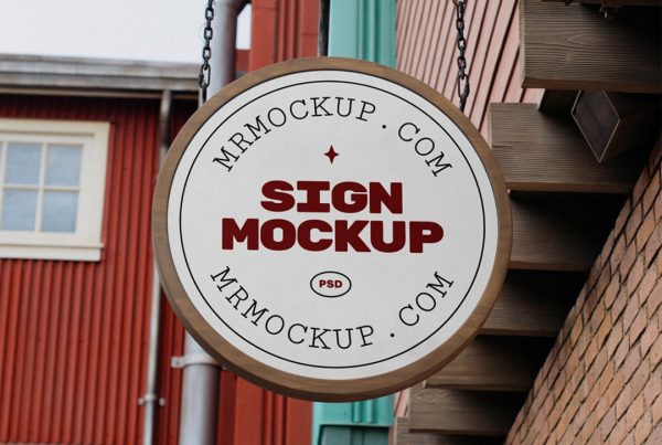 Front view, Free Circle Sign Mockup with wooden frame hanging on the chains attached to metal tube and brick wall.