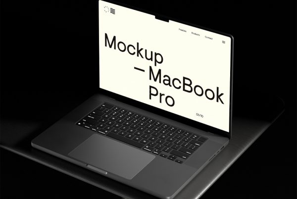 Front view, MacBook Pro Mockup standing on the black table.