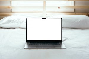 Free MacBook Pro On Bed Mockup — Mr.Mockup