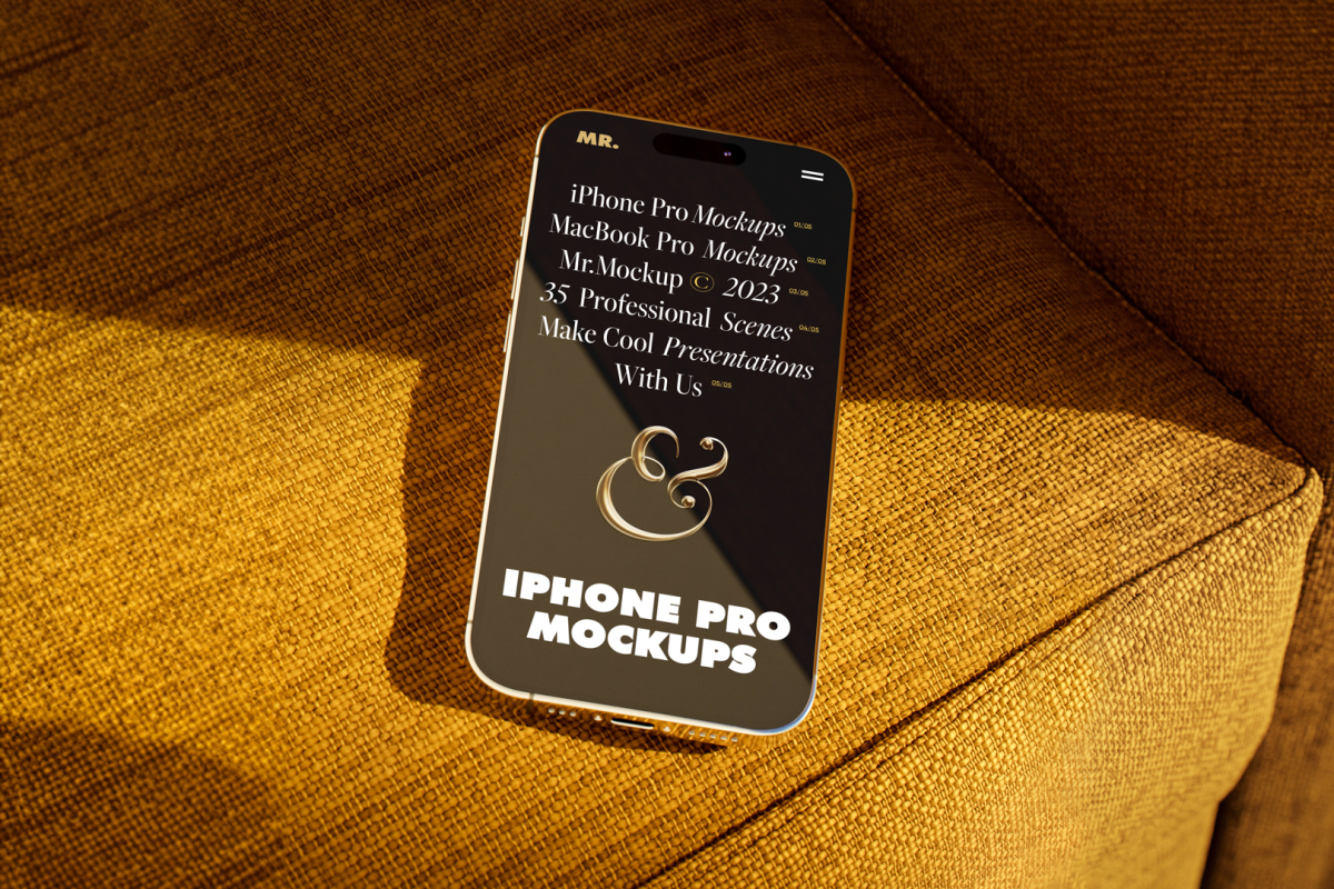 Seen from above, gold iPhone 14 Pro Mockup with black design laying on the reddish yellow couch.