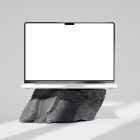 Front view, blank MacBook Pro Mockup standing on the big rock against a bright gray background.