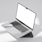 Front view, silver blank MacBook Pro Mockup standing on the gray/black rock laying on the bright gray floor.