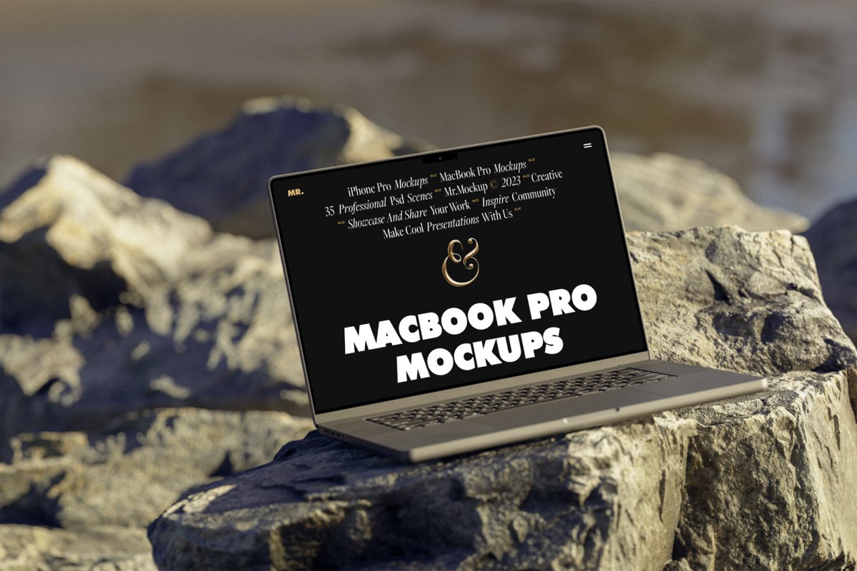 Front view, space gray MacBook Pro Mockup with black design standing on the sunny rocks on the beach against water in the background.