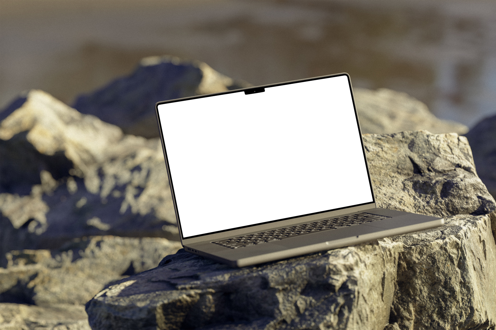 Front view, space gray blank MacBook Pro Mockup standing on the sunny rocks on the beach against water in the background.